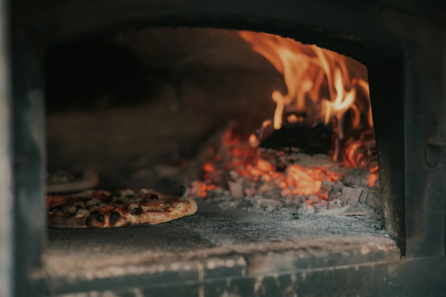 Pizza in the wood-fired oven on the reception ground.